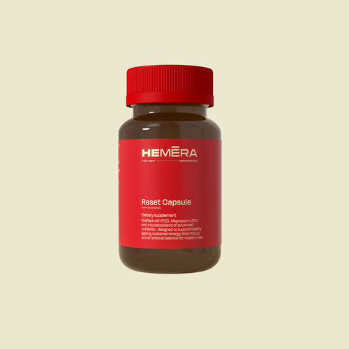 Bottle of HEMERA Reset Capsule on a beige background