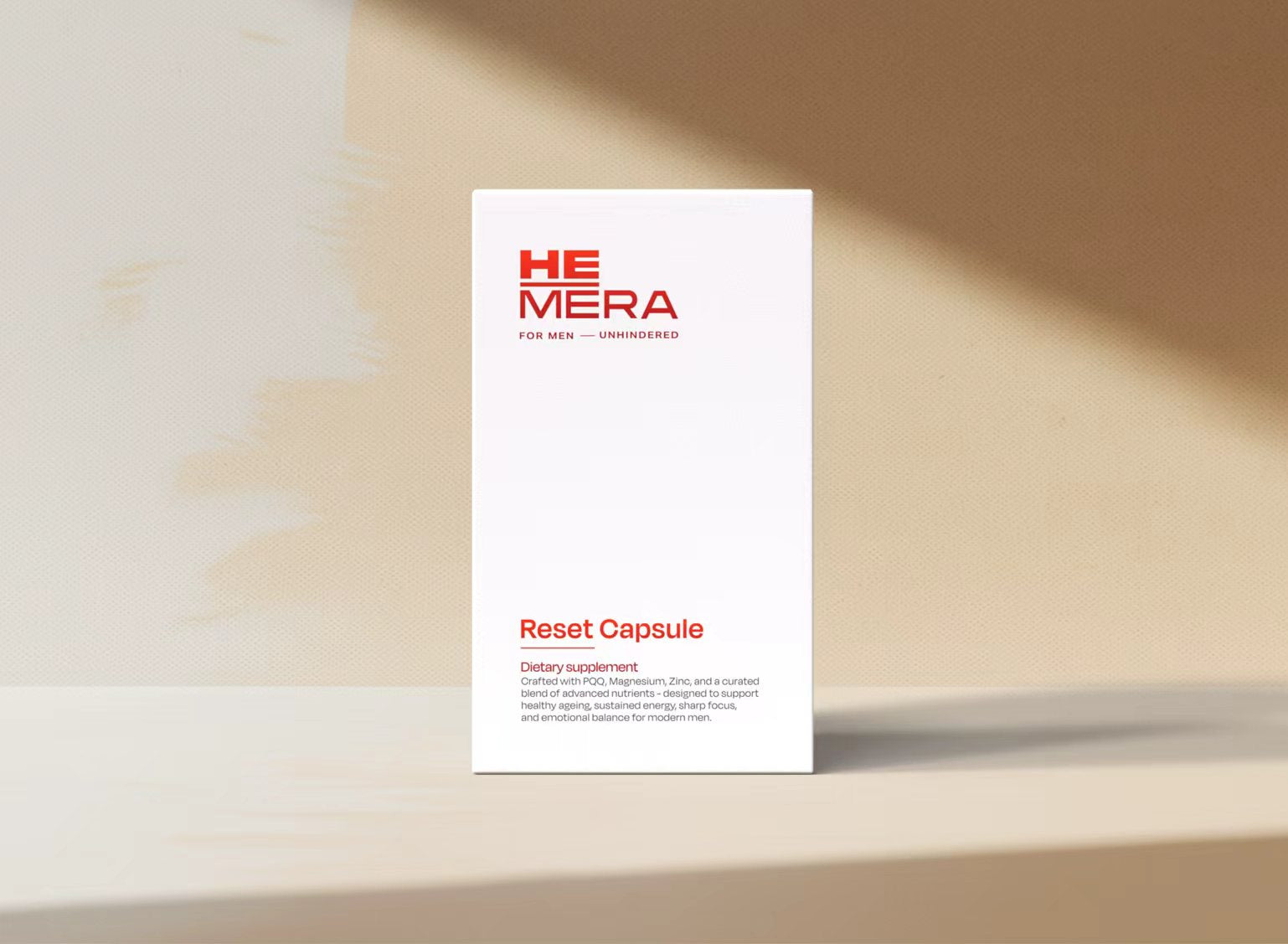 HEMERA Reset Capsule packaging on a beige surface with soft shadows