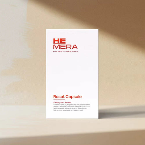 HEMERA Reset Capsule packaging on a beige surface with soft shadows